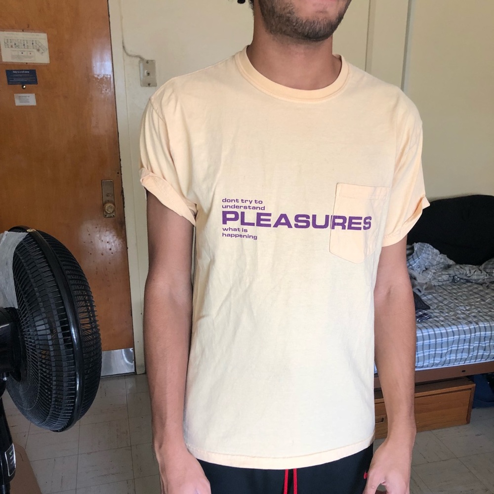 Pale Yellow “Pleasures” t-shirt